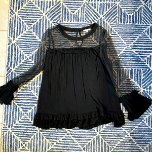 Black blouse with sheer top.